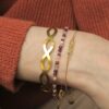 Armbandenset met gouden bangle, een roze mix Kralenarmband met edelstenen en een schakelarmband met lichtgele citrien.