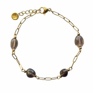 Gouden grove schakelarmband met rookkwarts kralen.